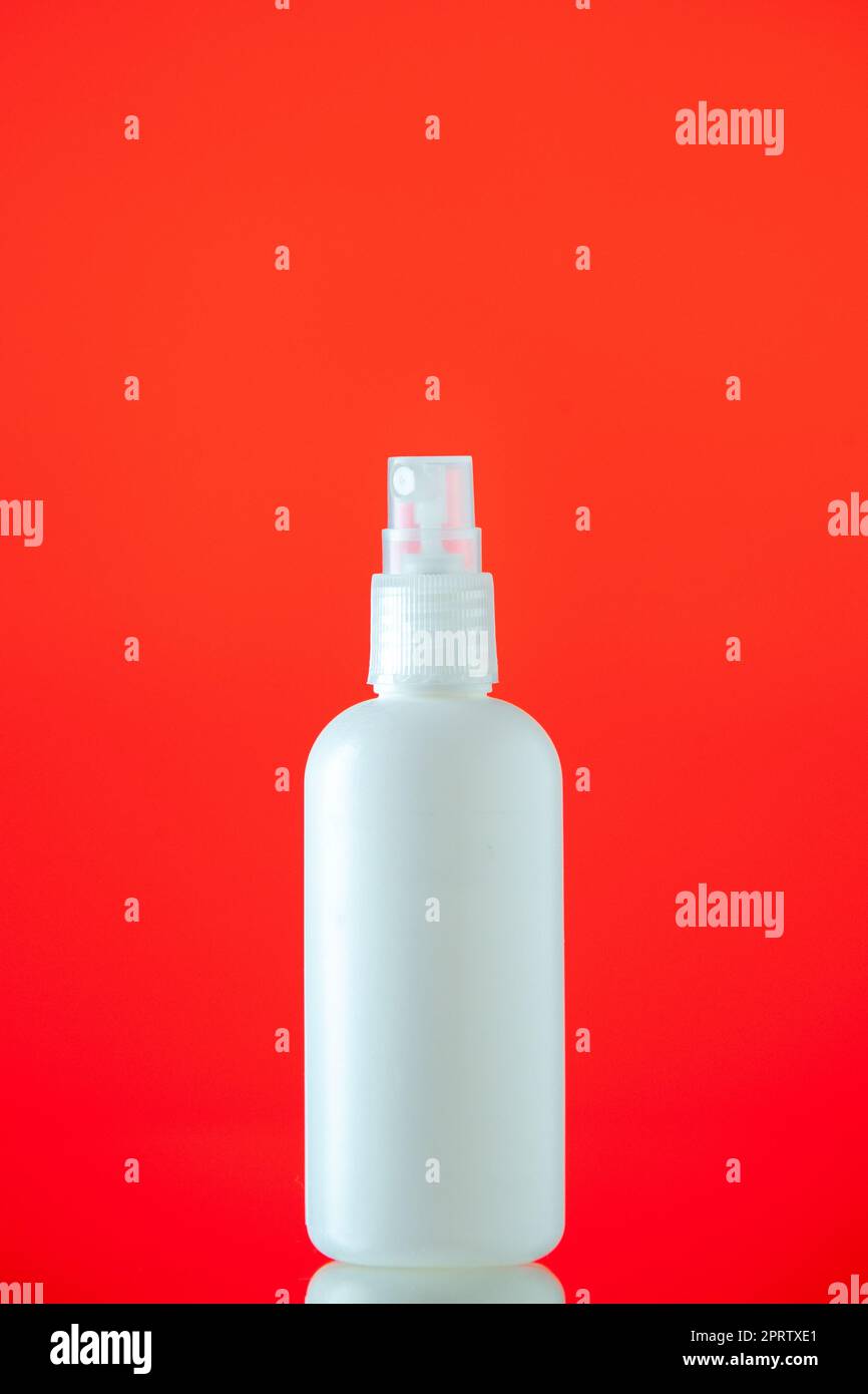 front view white spray bottle on red background stock photo Stock Photo ...