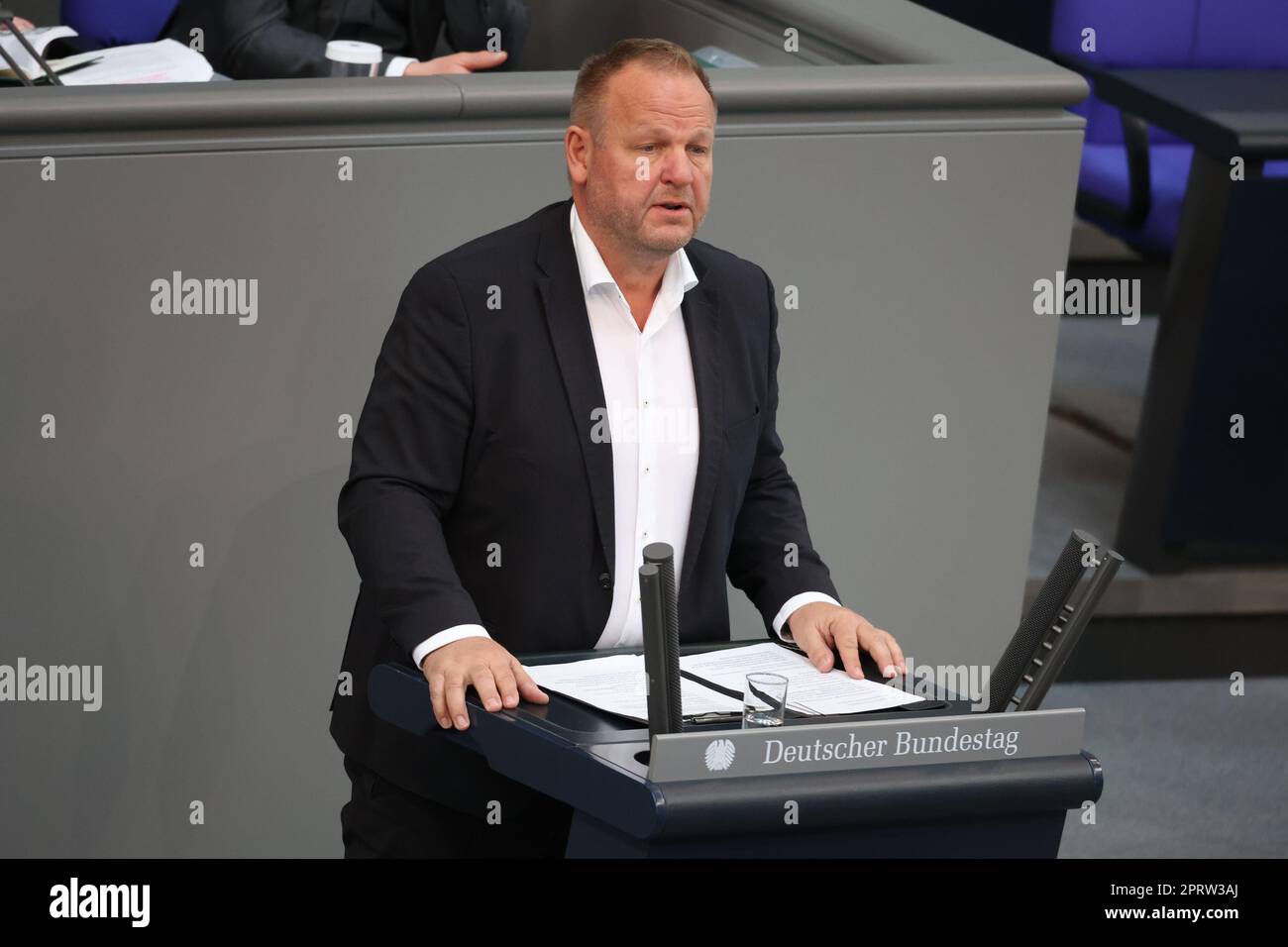 Berlin, Germany. 27th Apr, 2023. Kay-Uwe Ziegler (AfD) speaks at the 100th session of the German Bundestag in the plenary hall of the Reichstag building. The 'Care Support and Relief Act' is being debated. Credit: Jörg Carstensen/dpa/Alamy Live News Stock Photo