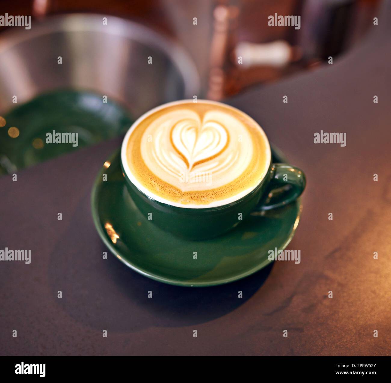 Coffee culture. High angle shot of a lovingly prepared cup of cappuccino sitting on a cafe table. Stock Photo