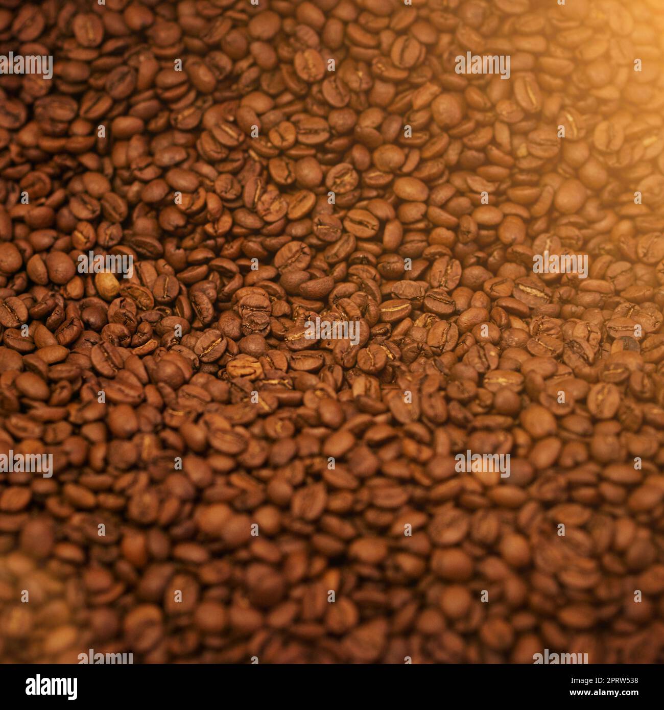 The finest beans. High angle shot of freshly roasted coffee beans. Stock Photo