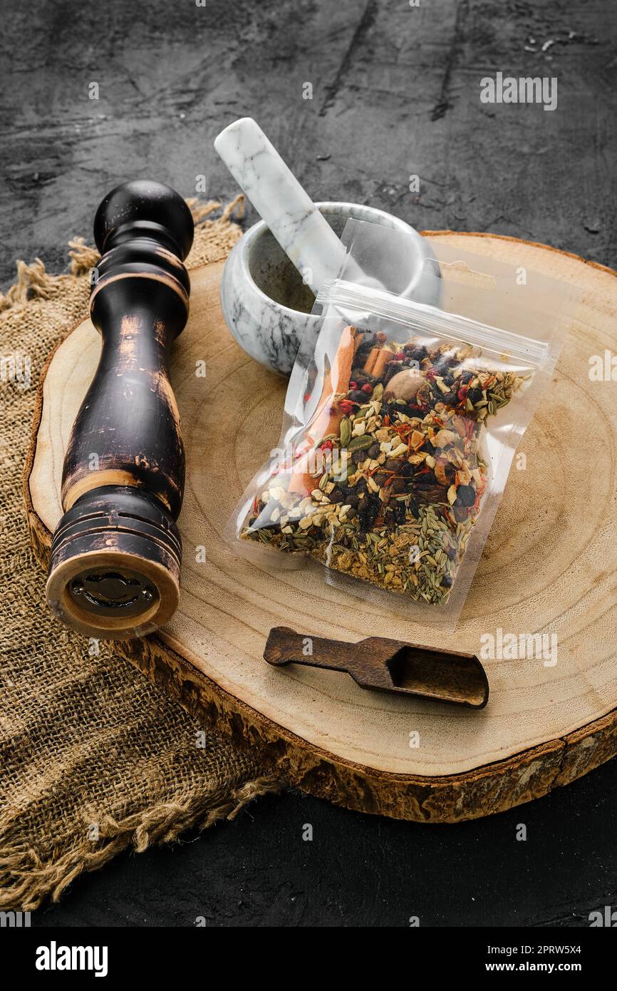 Spices Section Wooden cross section with set for mulled wine spices in plastic package ...