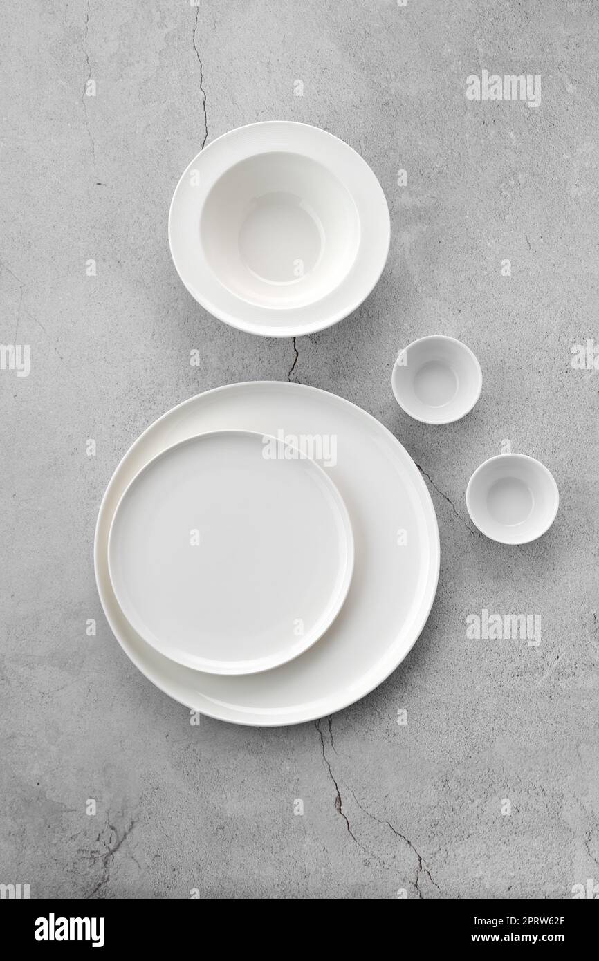 Overhead view of white tableware Stock Photo - Alamy