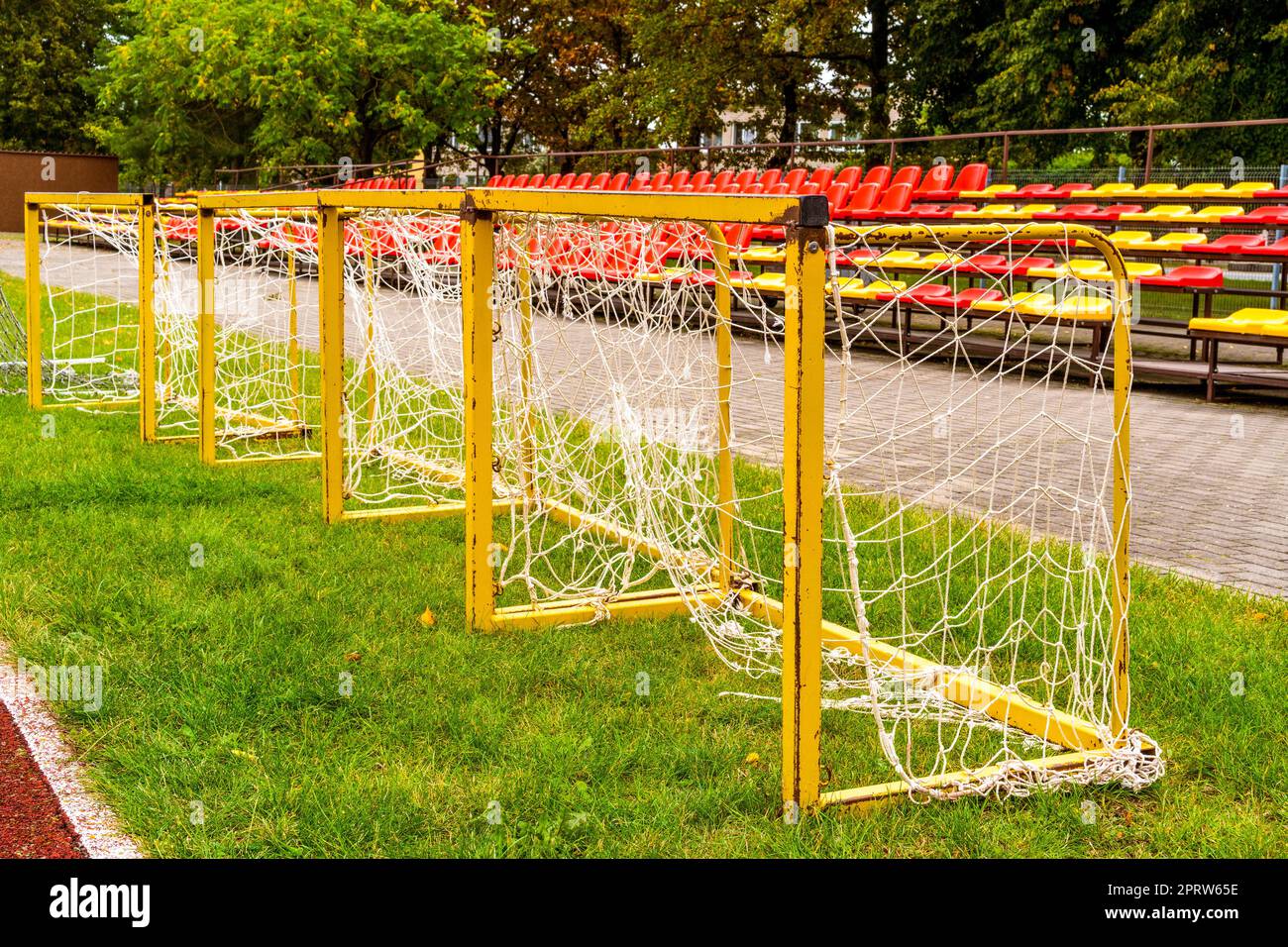 Small soccer goals lined up on a stadium Stock Photo