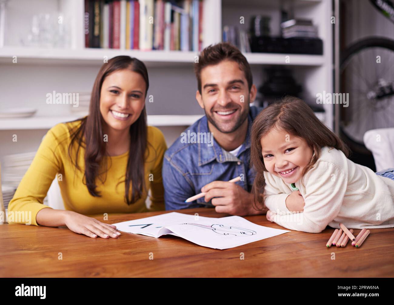 Every child is an artist. a young family doing art work together. Stock Photo