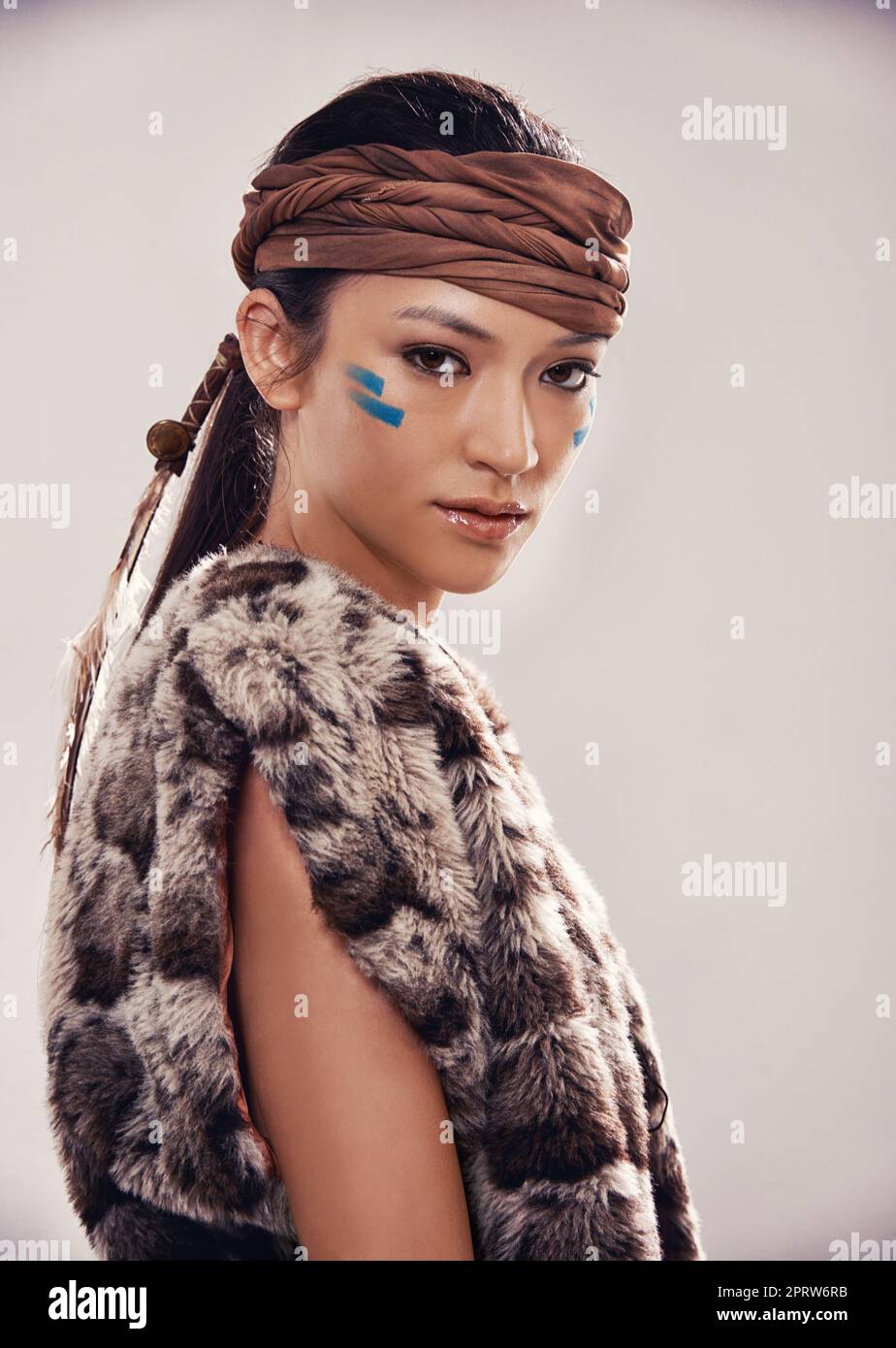 Wear your heritage. Studio portrait of an attractive young native american styled woman. Stock Photo