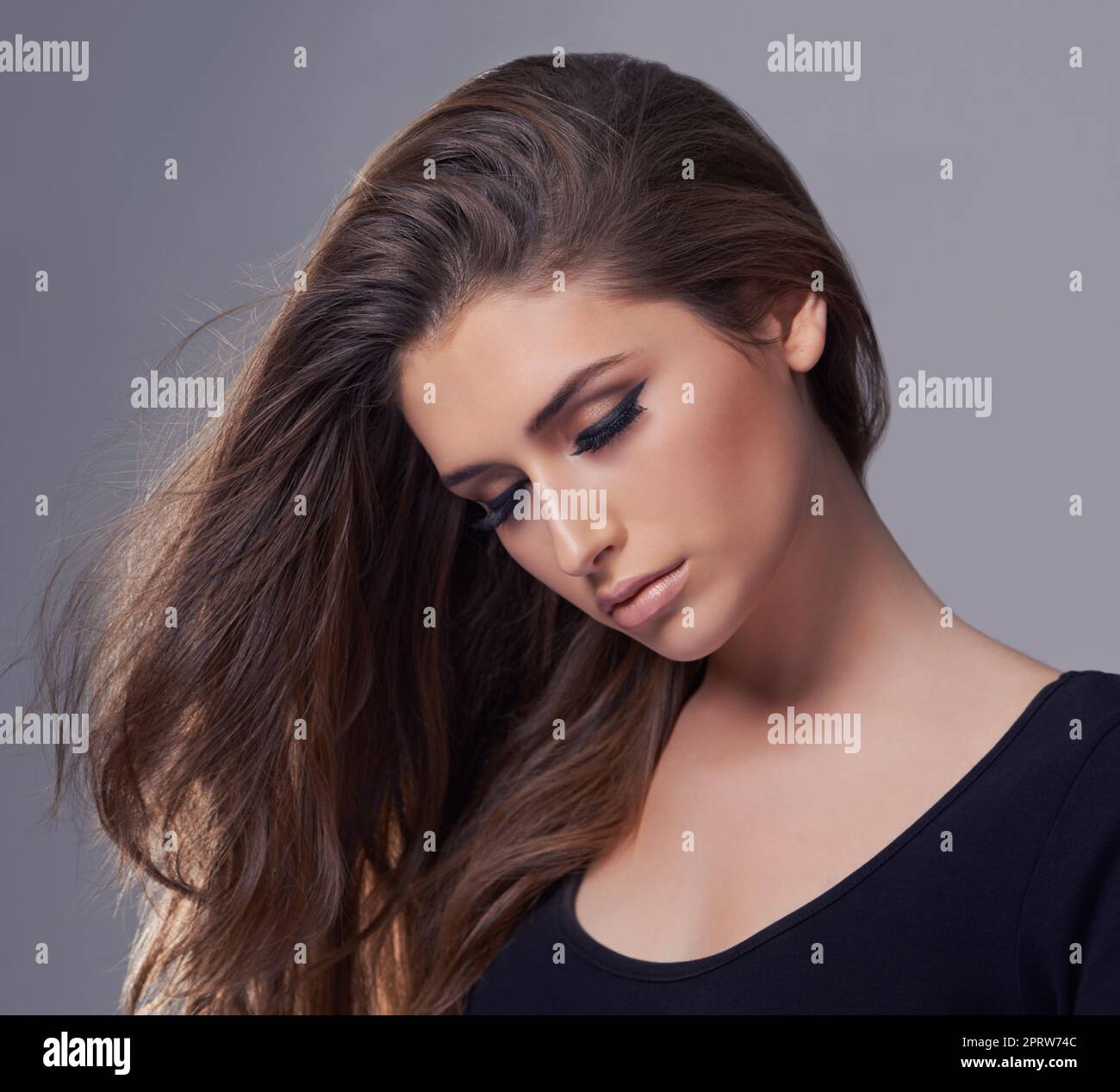 Elegance of the sultry beauty. Studio shot of a gorgeous young woman. Stock Photo