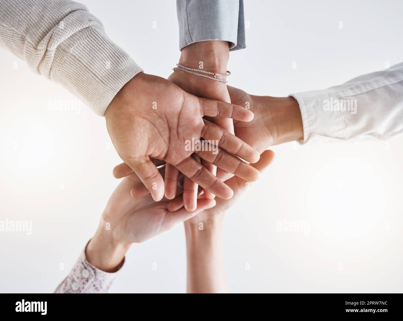 Teamwork hands, partnership and collaboration support for winner, motivation and vision of goals. Below business group people connect in trust, success commitment and working for solidarity together Stock Photo