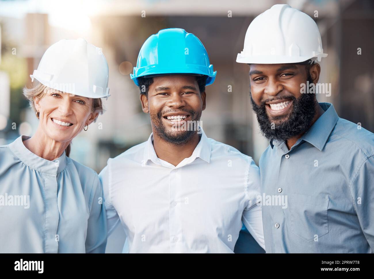 Architect portrait, work diversity and construction workers working on building project together, happy with architecture and industrial team in the city. Engineer group with smile for design job Stock Photo