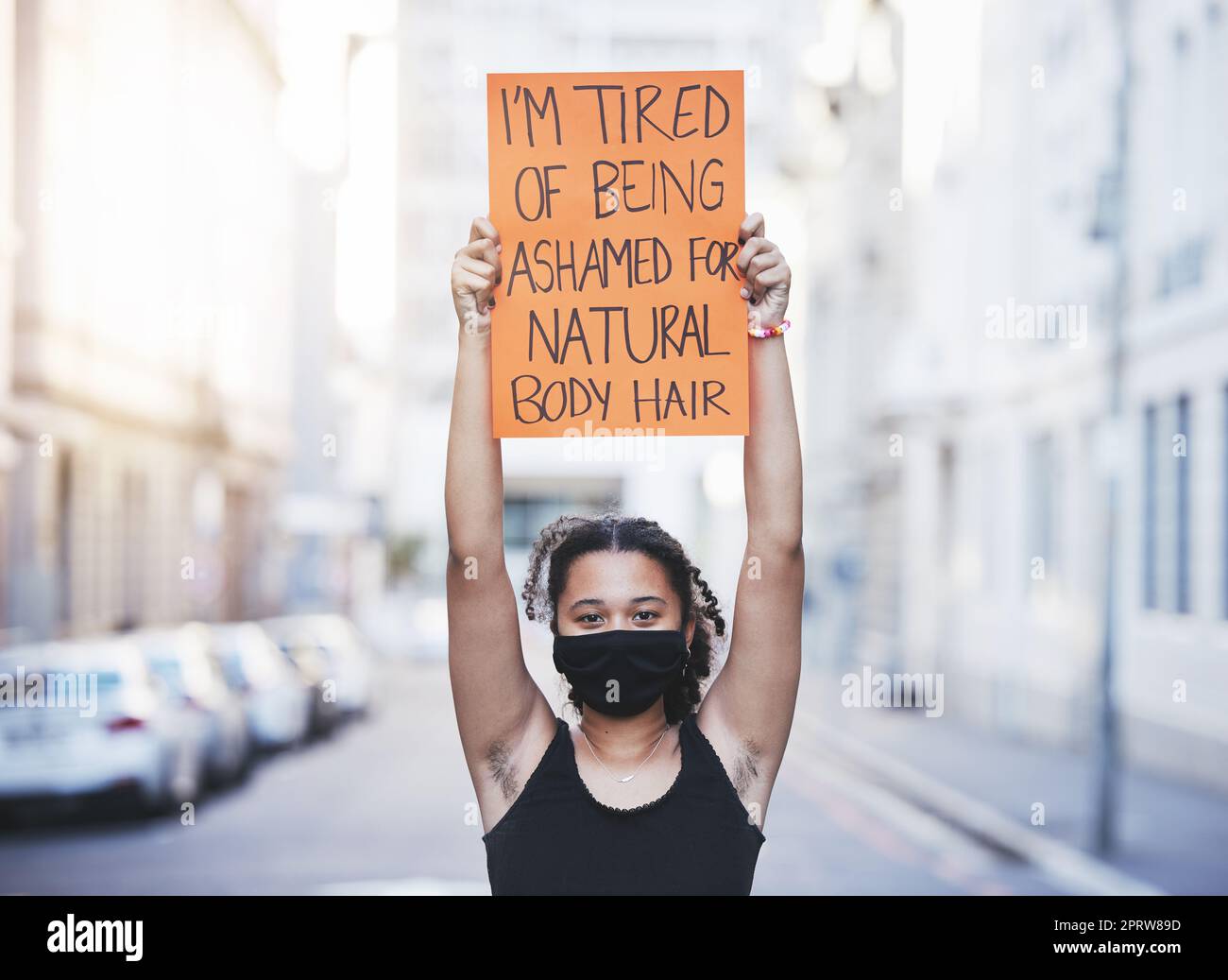Women human rights, hair removal choice and protest, rally and feminist revolution against beauty standards, freedom and gender equality. Woman showing hairy body armpit, justice and poster opinion Stock Photo