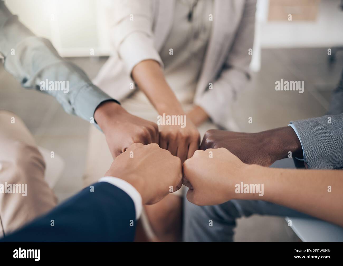 Teamwork, diversity hands and trust with business people with fist together for collaboration, support and motivation. Closeup of multiethnic group, team and colleagues working for growth and success Stock Photo