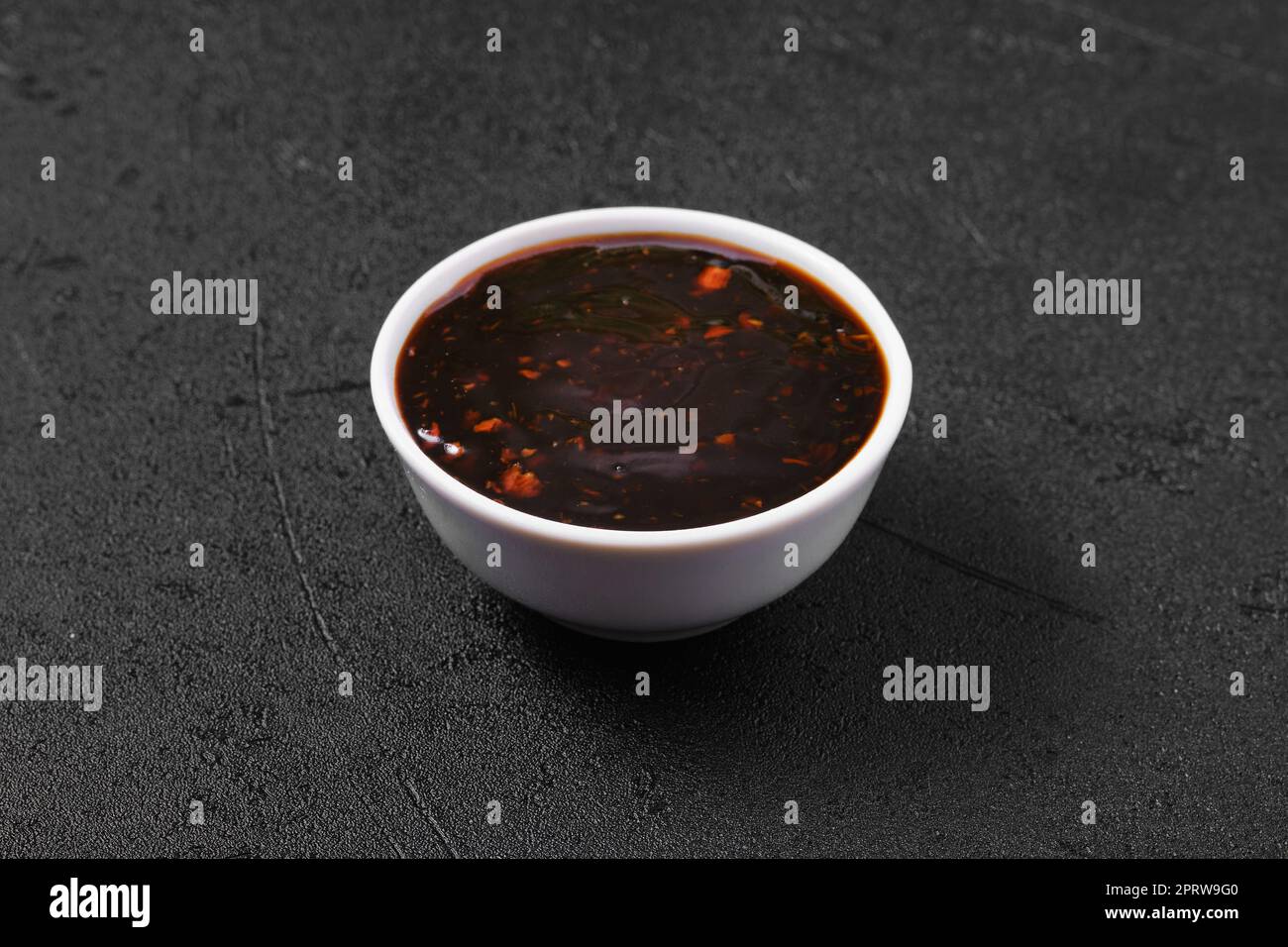 Small bowl with spicy teriyaki sauce Stock Photo