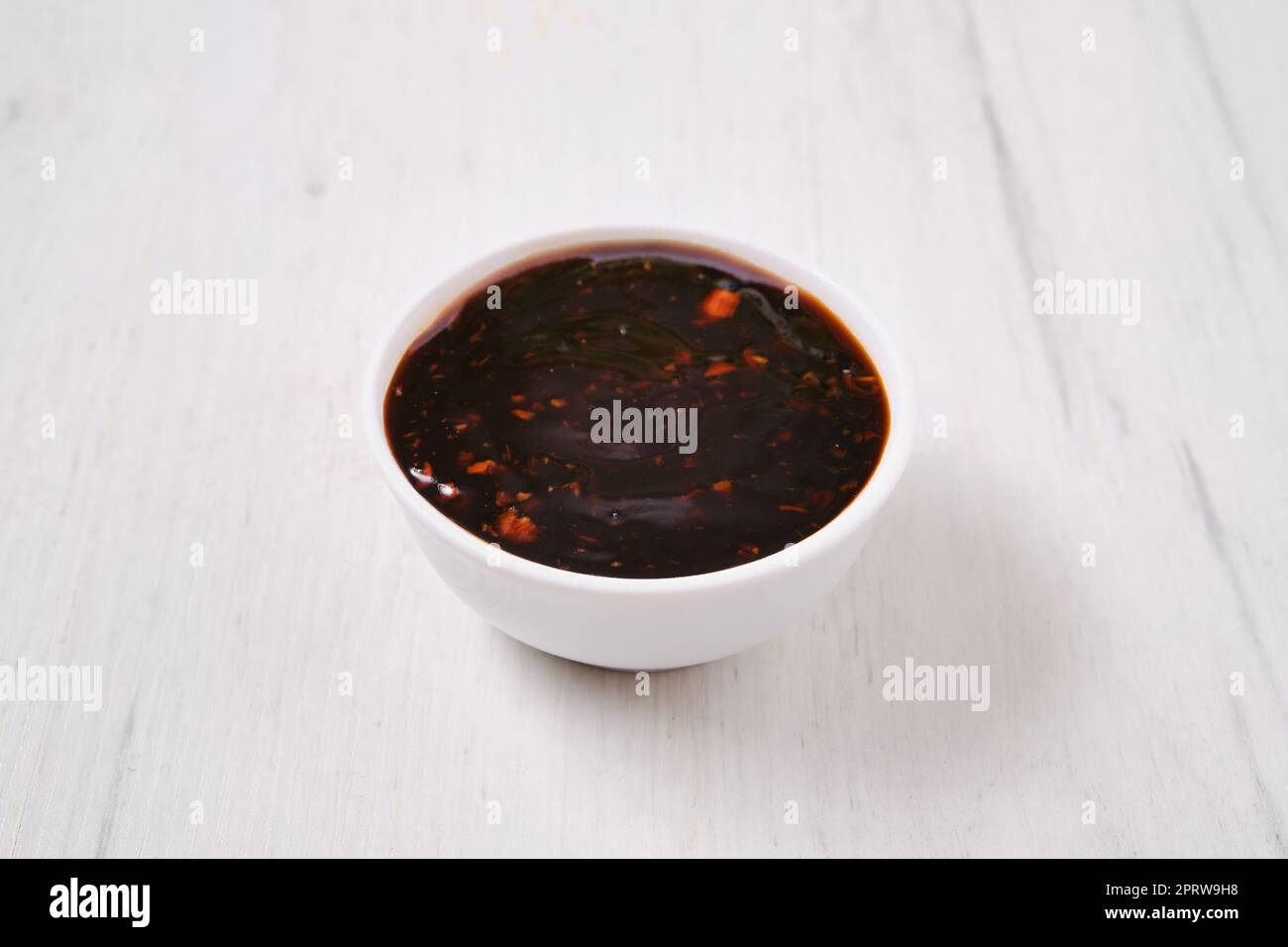 Small bowl with spicy teriyaki sauce Stock Photo