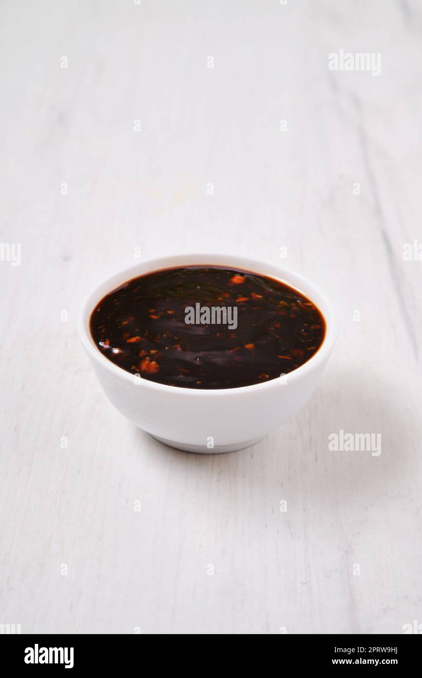 Small bowl with spicy teriyaki sauce Stock Photo