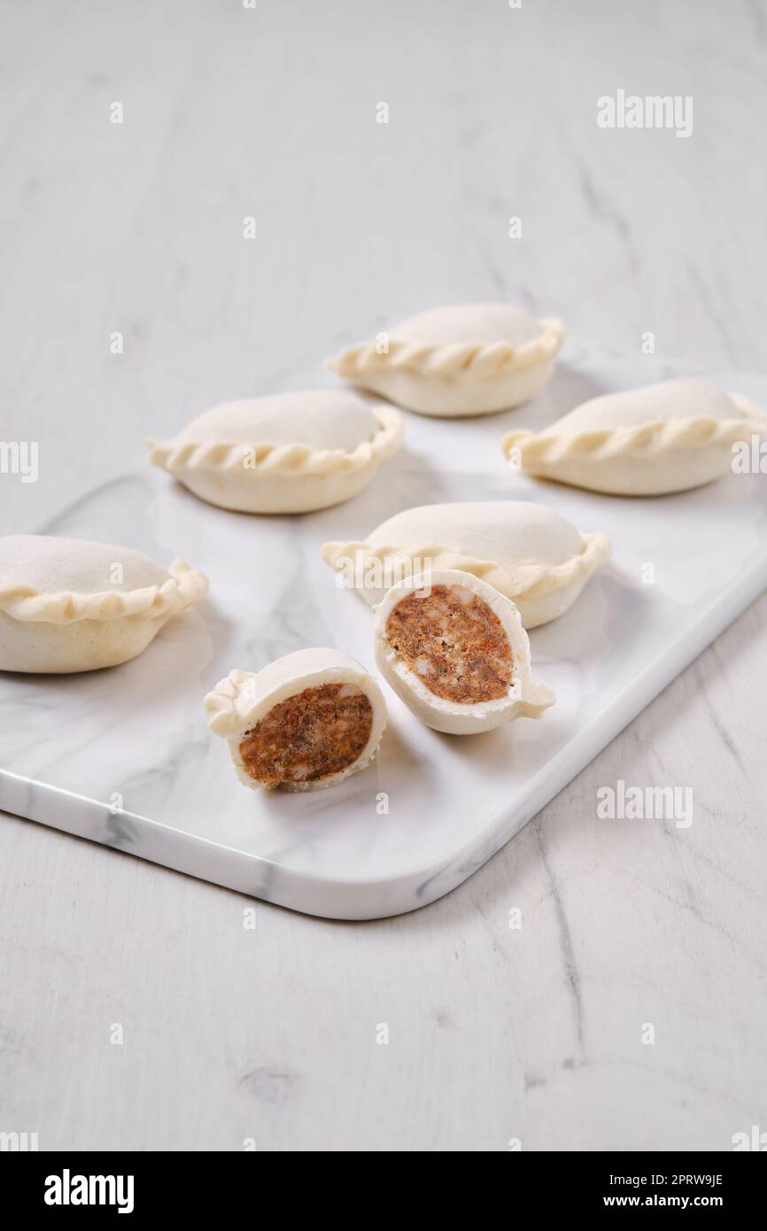 Frozen dumplings stuffed with beef meat and provencal herbs Stock Photo