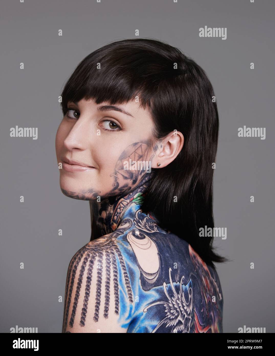 I dont hide my awesome. A cropped studio portrait of a tattooed young woman. Stock Photo