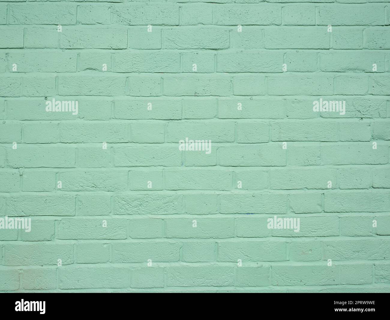 light green brick wall useful as a background Stock Photo - Alamy