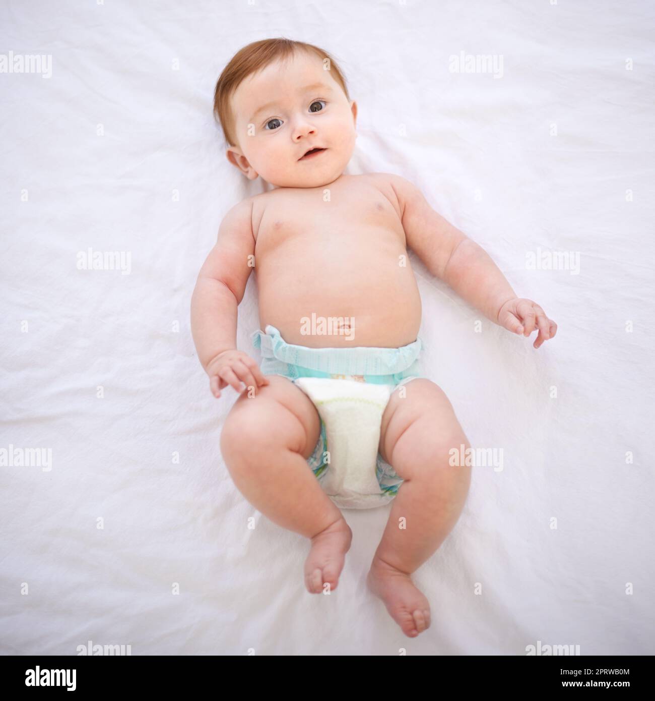 Time for a diaper change. an adorable baby girl with red hair Stock Photo -  Alamy