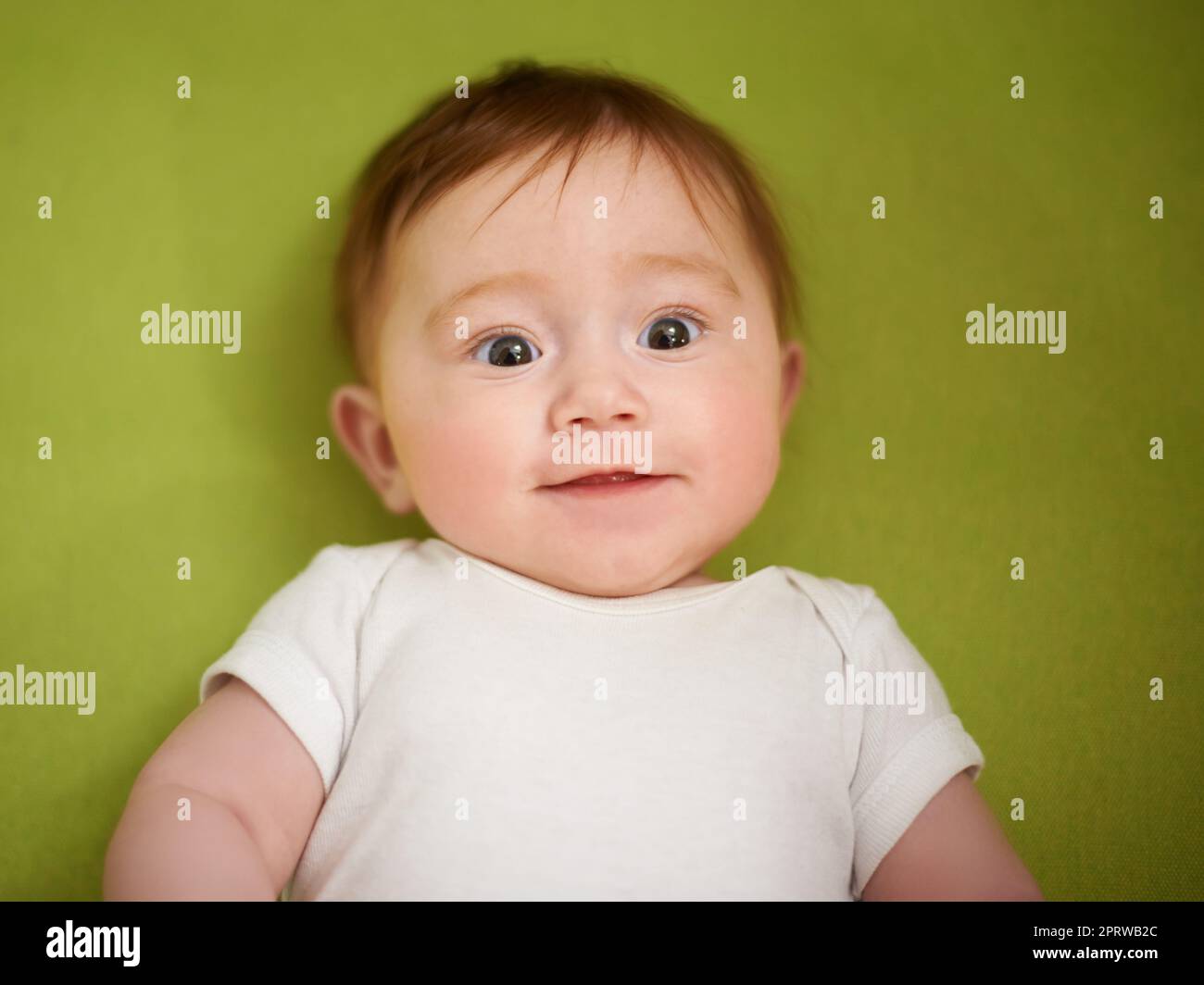 Shes an adorable bundle of joy. an adorable baby girl with red hair. Stock Photo