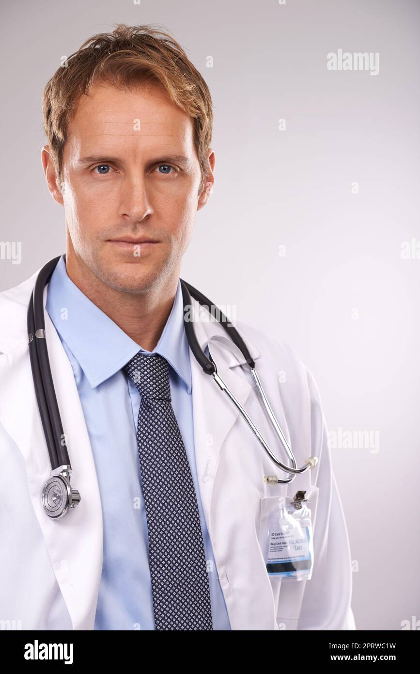 Hes serious about your health. Cropped studio portrait of a serious young male doctor. Stock Photo