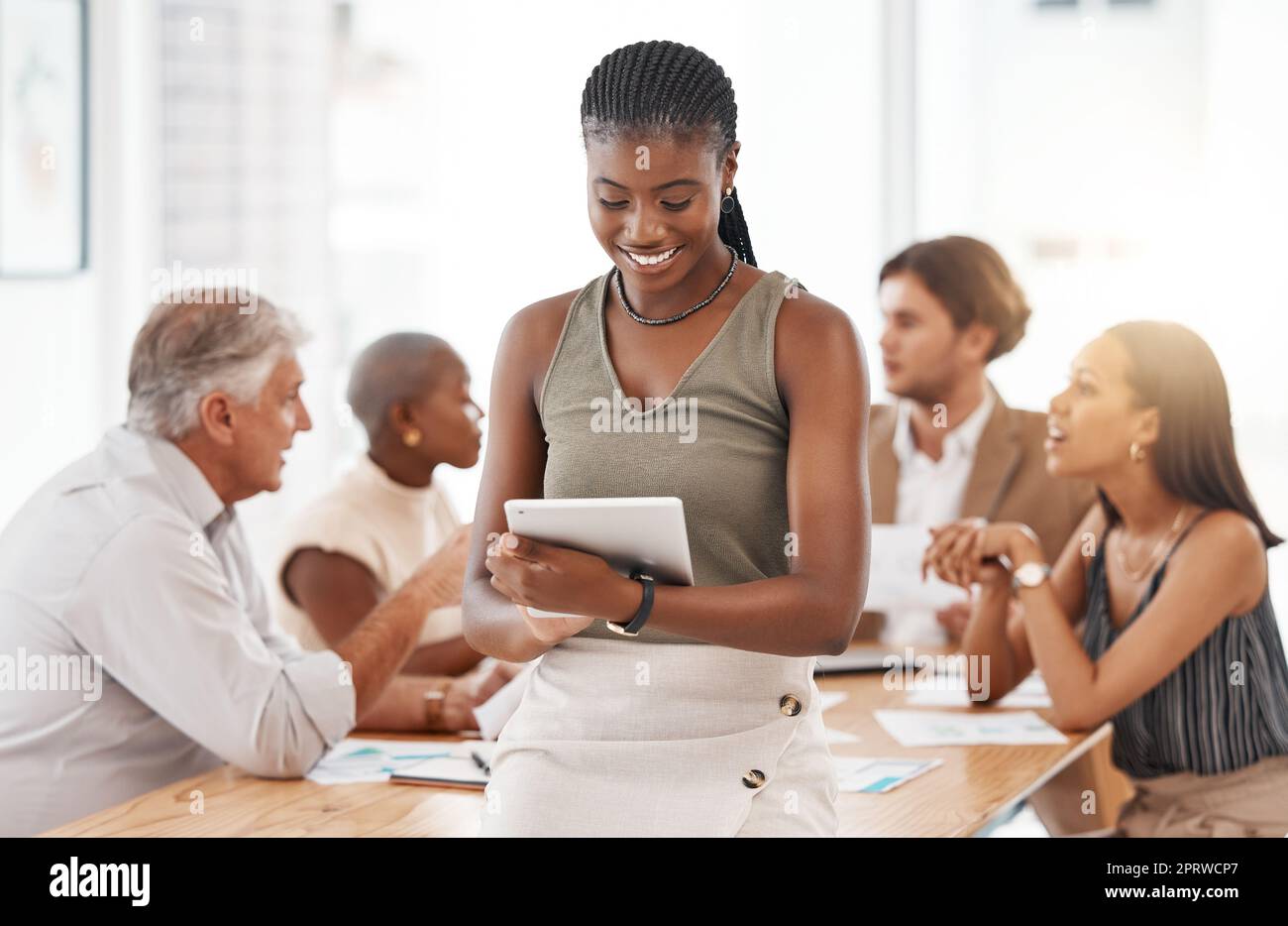 Tablet and business woman with solution, leadership and company goal for success. Happy smile of manager in a team building discussion working on people management strategy on a planner software app Stock Photo