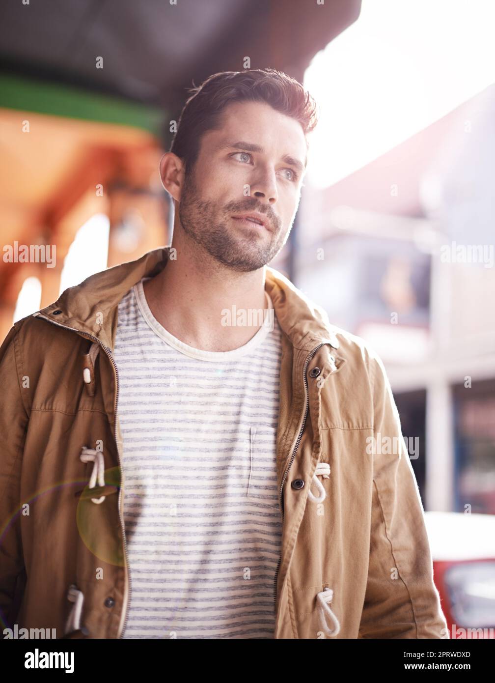So many things to see. a fashionable young man strolling through the city. Stock Photo
