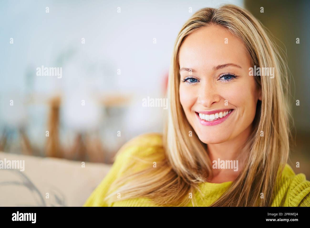 Her beauty is perfect. a relaxed young woman on her sofa at home. Stock Photo