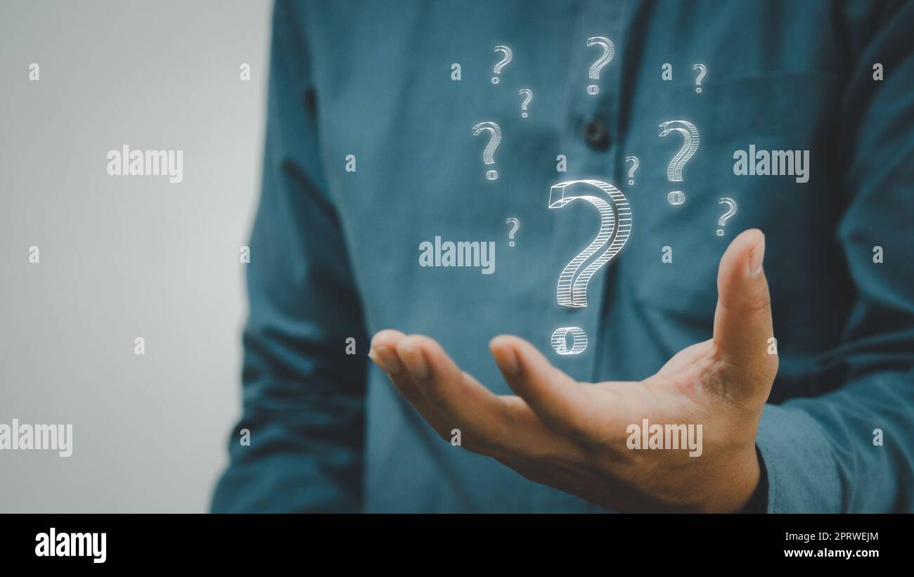 business man icon questions marks on virtual screen at interrogation. Stock Photo