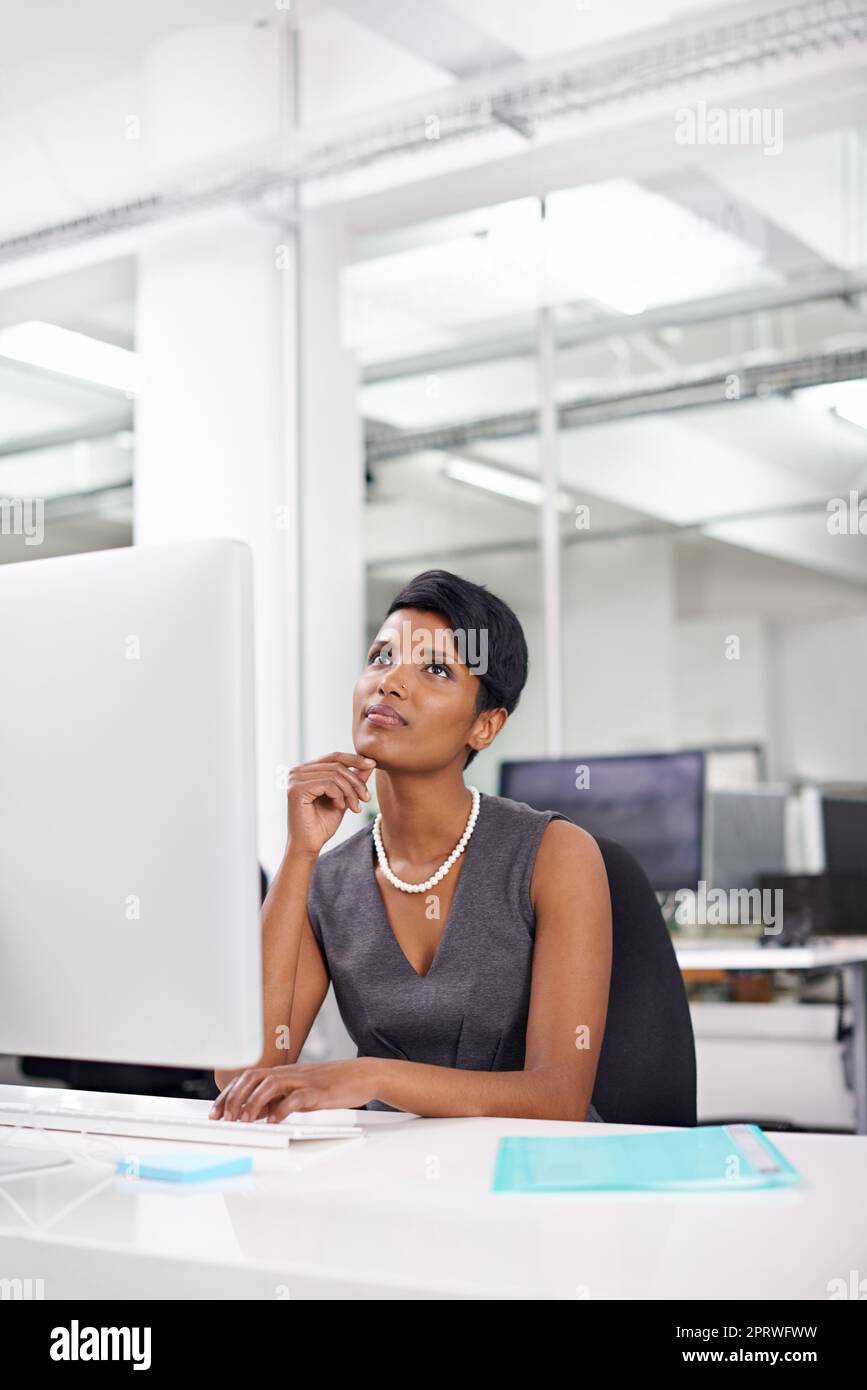 Its gotta be perfect...an attractive young woman businesswoman in her office. Stock Photo