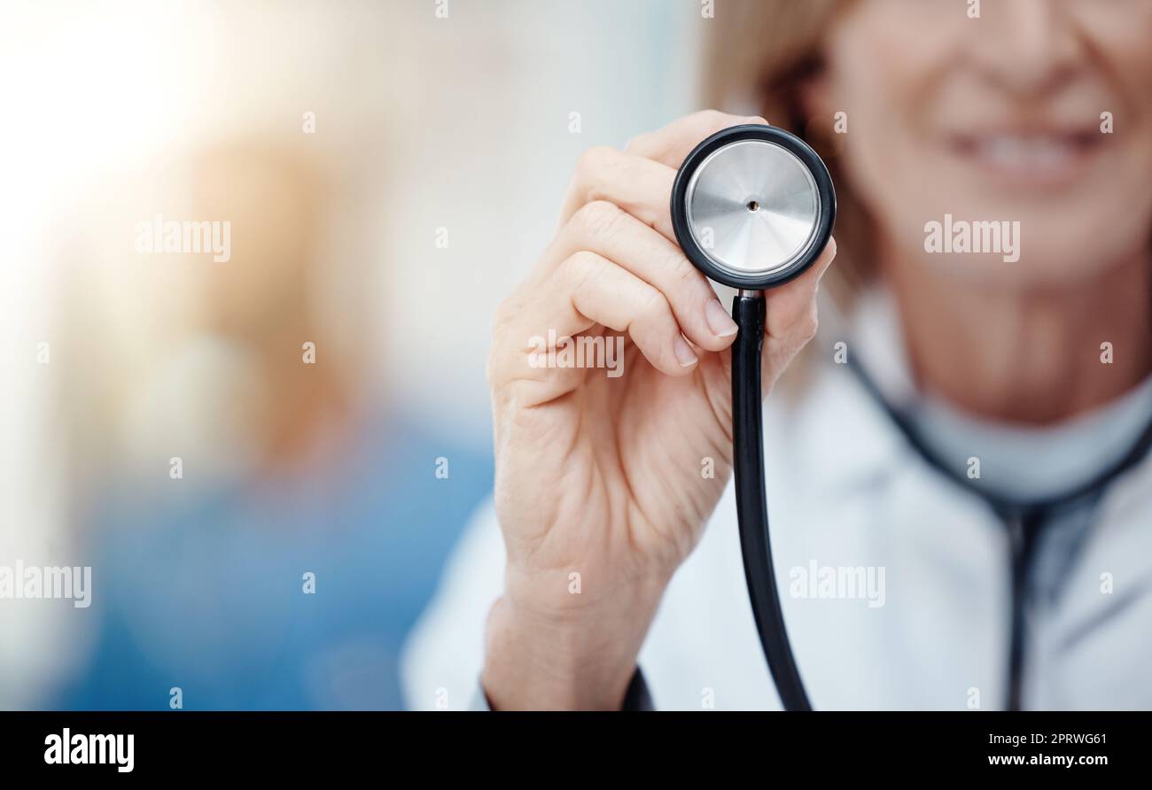 Premium Photo  Doctor coat with medical stethoscope and red heart on the  desk