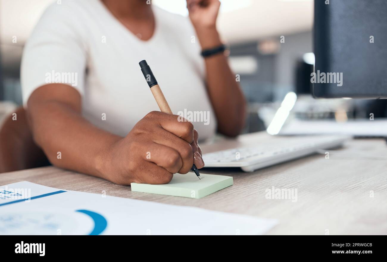 Receptionist, secretary or consultant with phone, writing client info on sticky note. Crm, communication and support, customer service at telemarketing company. Black woman consulting on office phone Stock Photo