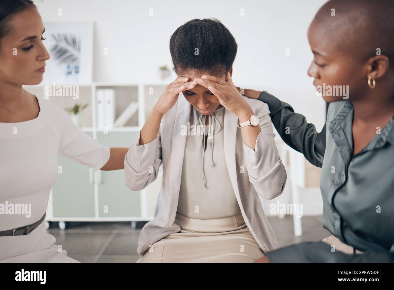 Mental health, depression and business support group with woman comfort friend after getting bad news at work. Unhappy, fired and sad employee in friends circle showing unity, kindness and community Stock Photo