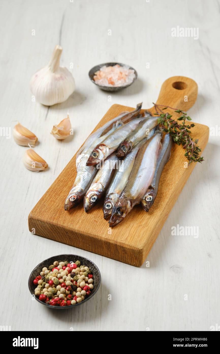 Fresh raw frozen capelin Stock Photo - Alamy
