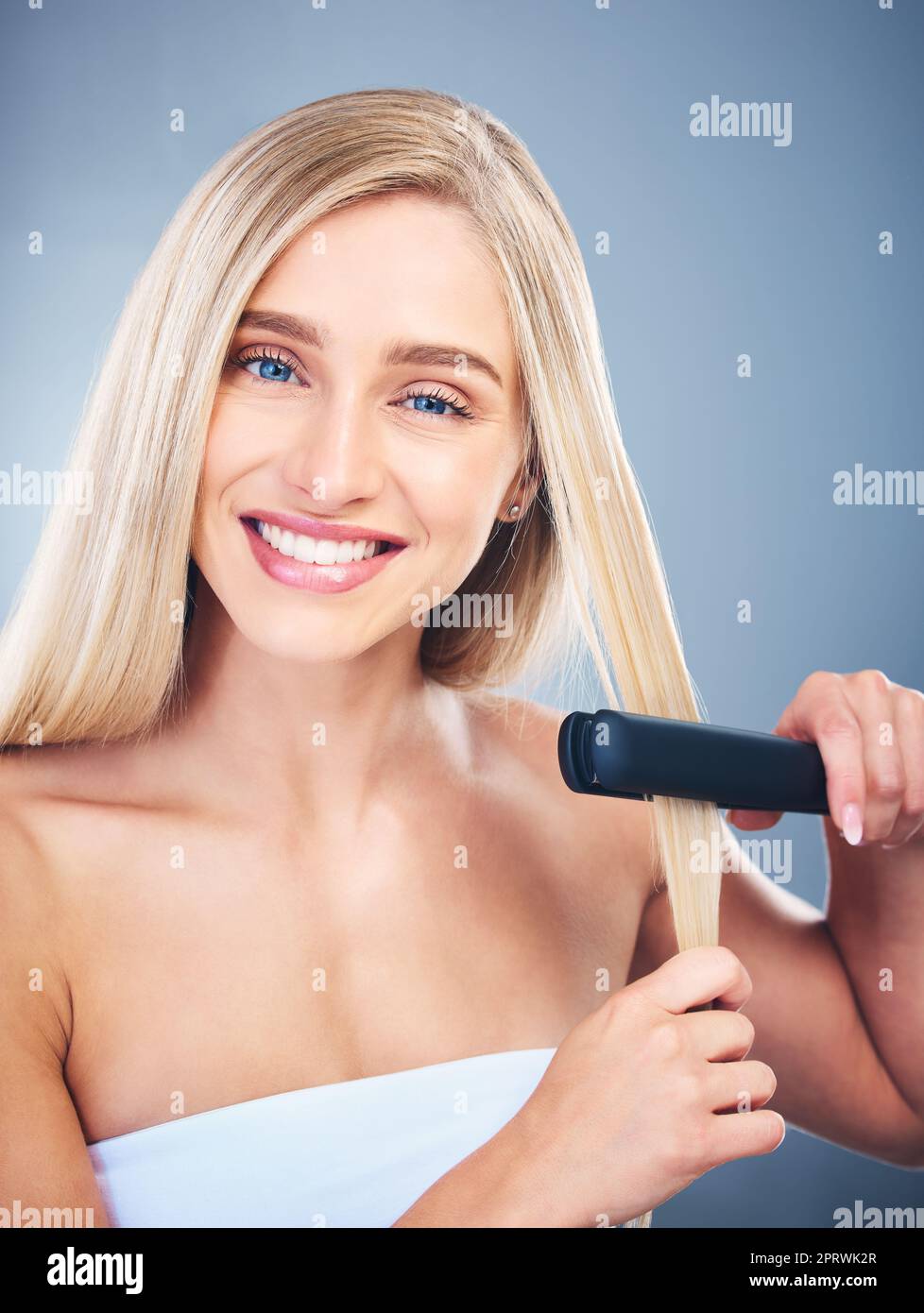 Portrait of blonde happy woman, flat iron aesthetic for beauty salon