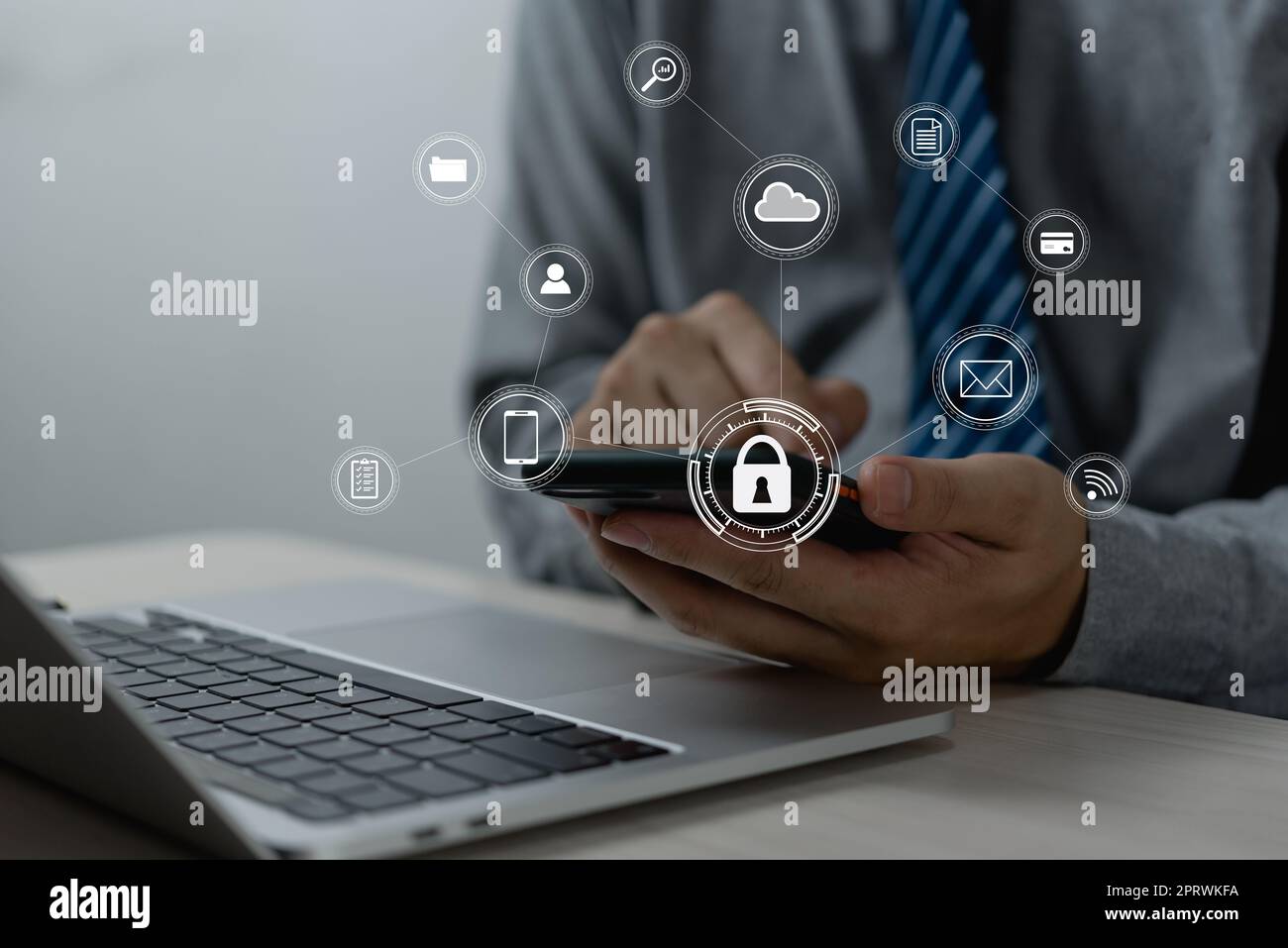 Businessman working with smartphone in hands. Cybersecurity hologram with glowing lock icons on the virtual screen.Business technology internet and networking concept Stock Photo