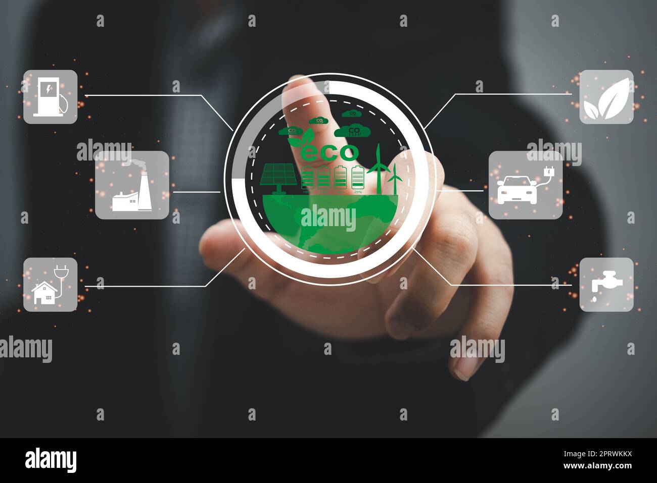 Businessman touching screen virtual icon eco energy sustainable environment digital technology concept. Stock Photo