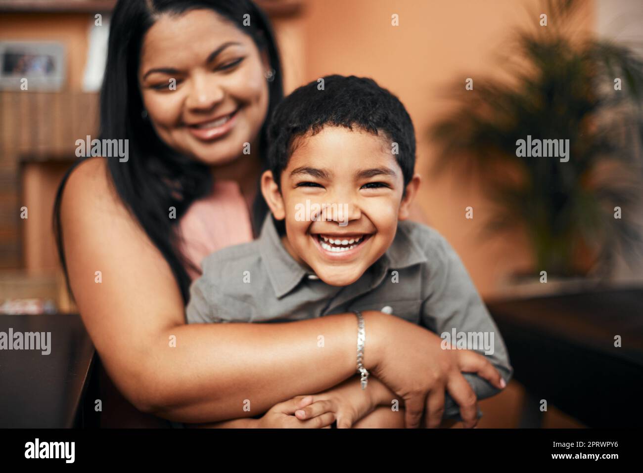A boys best friend is his mother. Portrait of an adorable little boy bonding with his mother at home. Stock Photo