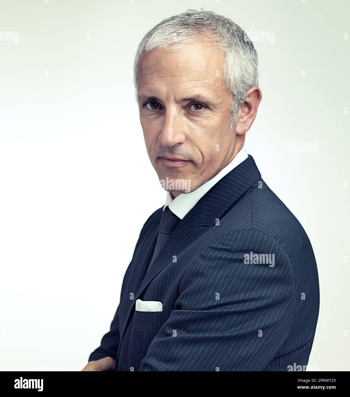 Looking sharp. A cropped portrait of a confident mature man wearing a pinstripe suit. Stock Photo