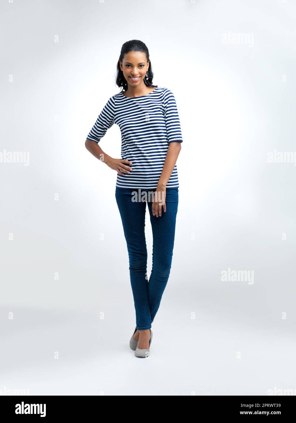 Loving her casual look. Full length studio portrait of a young african american woman isolated on white. Stock Photo