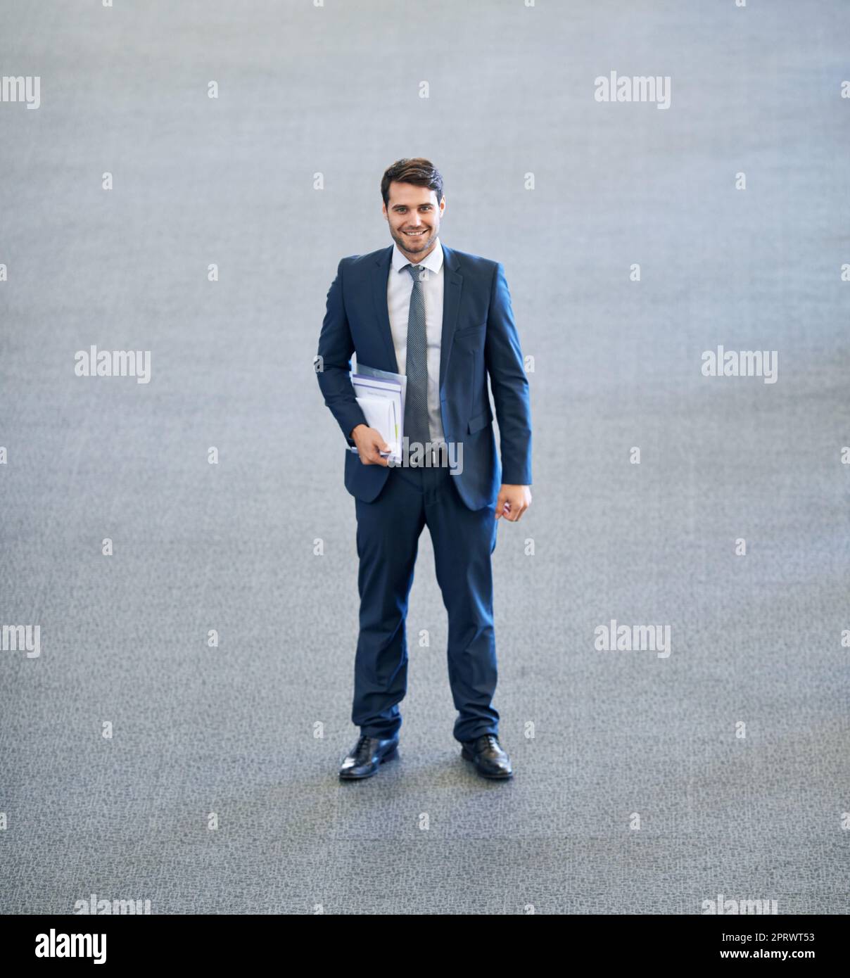 Theres nowhere to go but up. Full length shot of a young businessman holding paperwork. Stock Photo