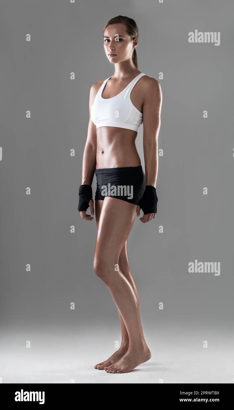 Standing tall after a great workout. Full length shot of an athletic woman  wearing workout clothes Stock Photo - Alamy