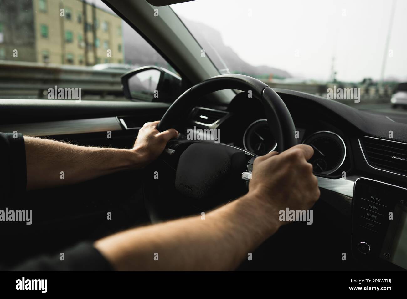 Arm on steering wheel hi-res stock photography and images - Alamy