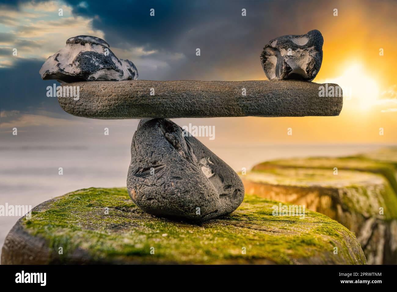 in balance - natural scales of stones by the sea - symbol photo Stock Photo
