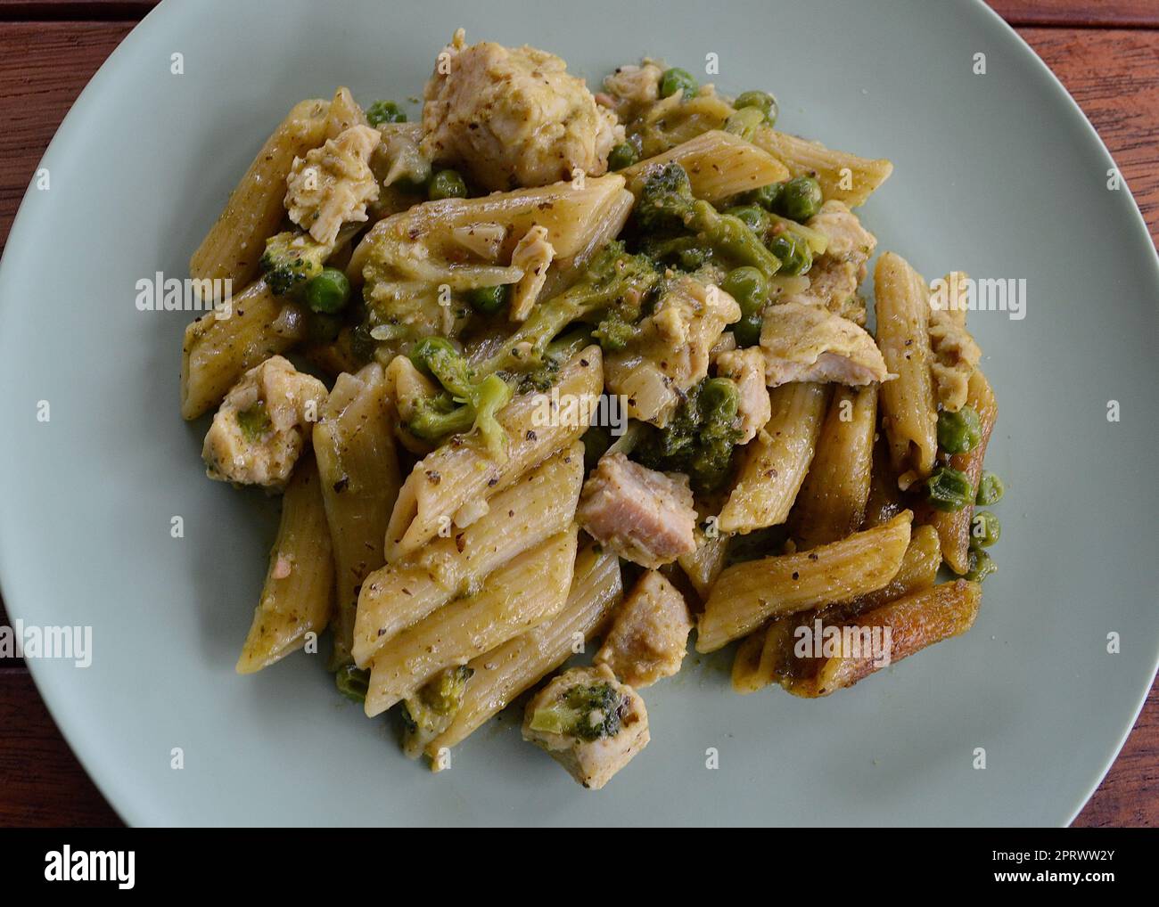 Chicken pesto pasta with vegetables Stock Photo