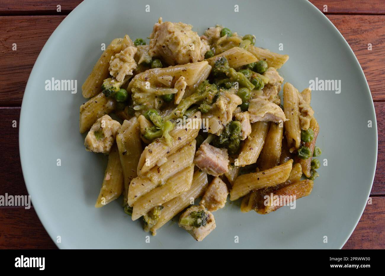 Chicken pesto pasta with vegetables Stock Photo Alamy