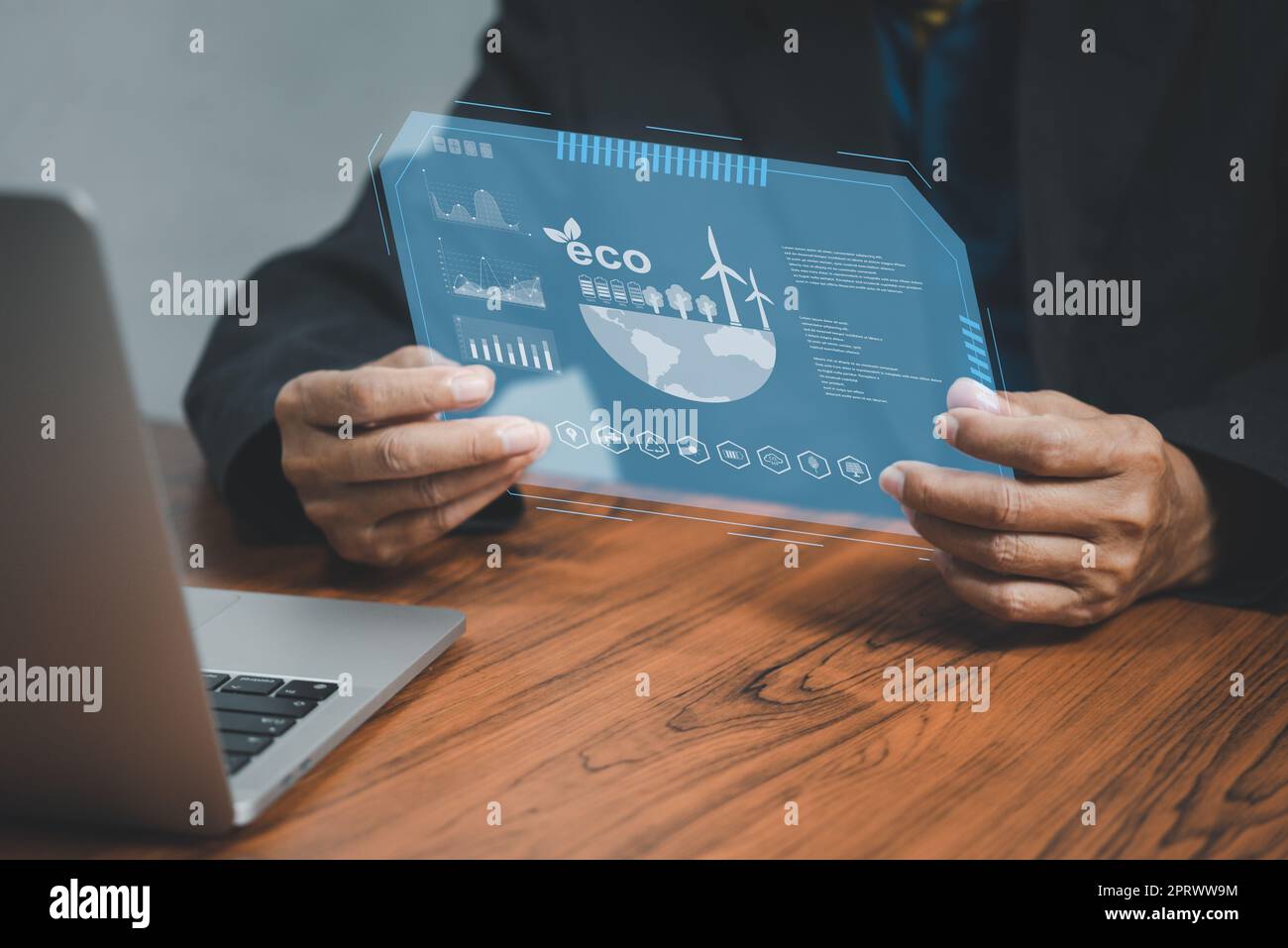 Businessman touching screen virtual icon eco energy sustainable environment digital technology concept. Stock Photo
