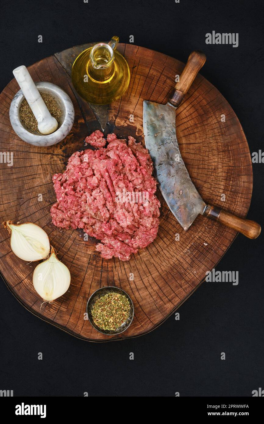 Making fresh mince meat with chopping knife, overhead view Stock Photo Alamy