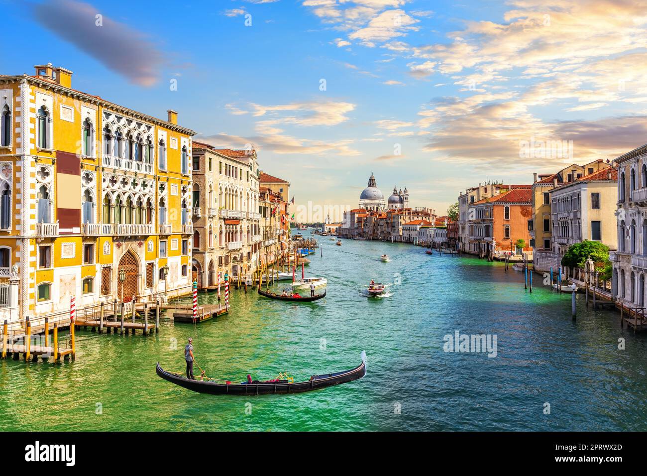 Gondoliers in the Grand Canal of Venice near Santa Maria della Salute, Italy Stock Photo