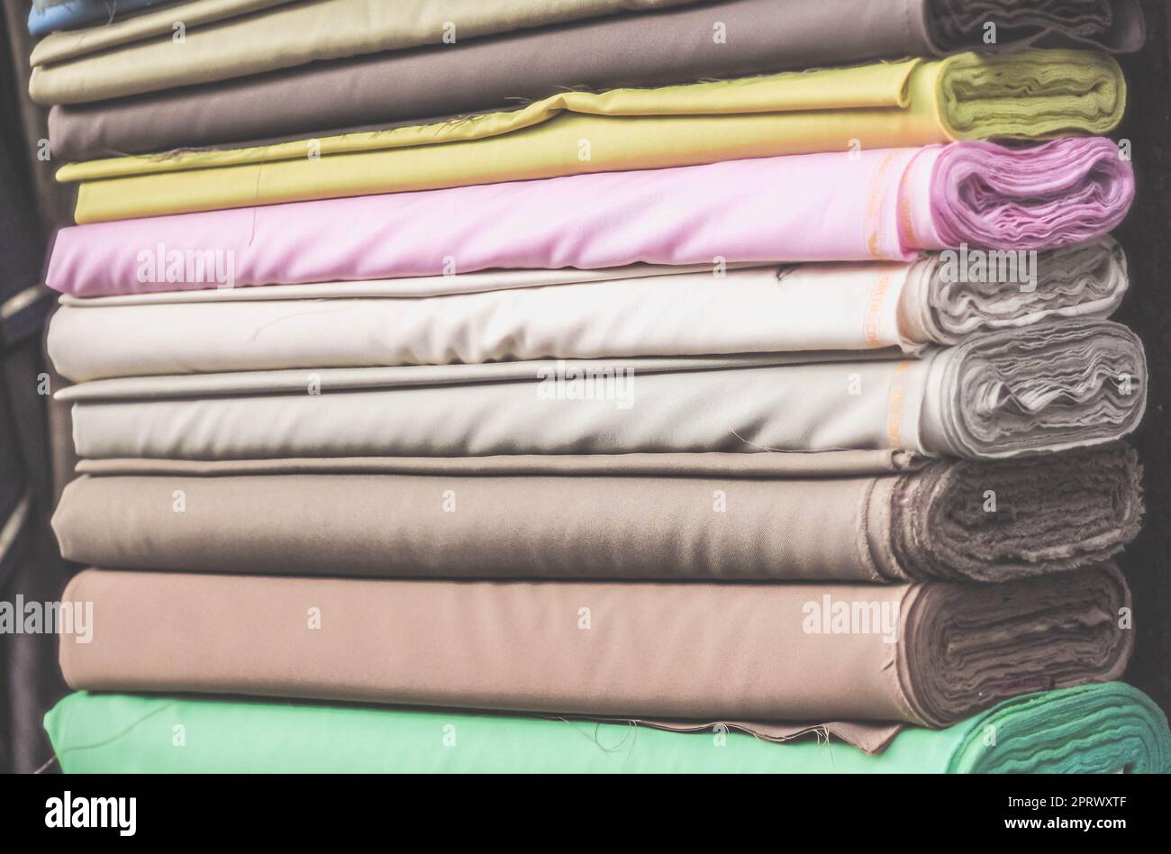 colorful fabric rolls in textile shop industry.Rolls of bright colored fabric Stock Photo