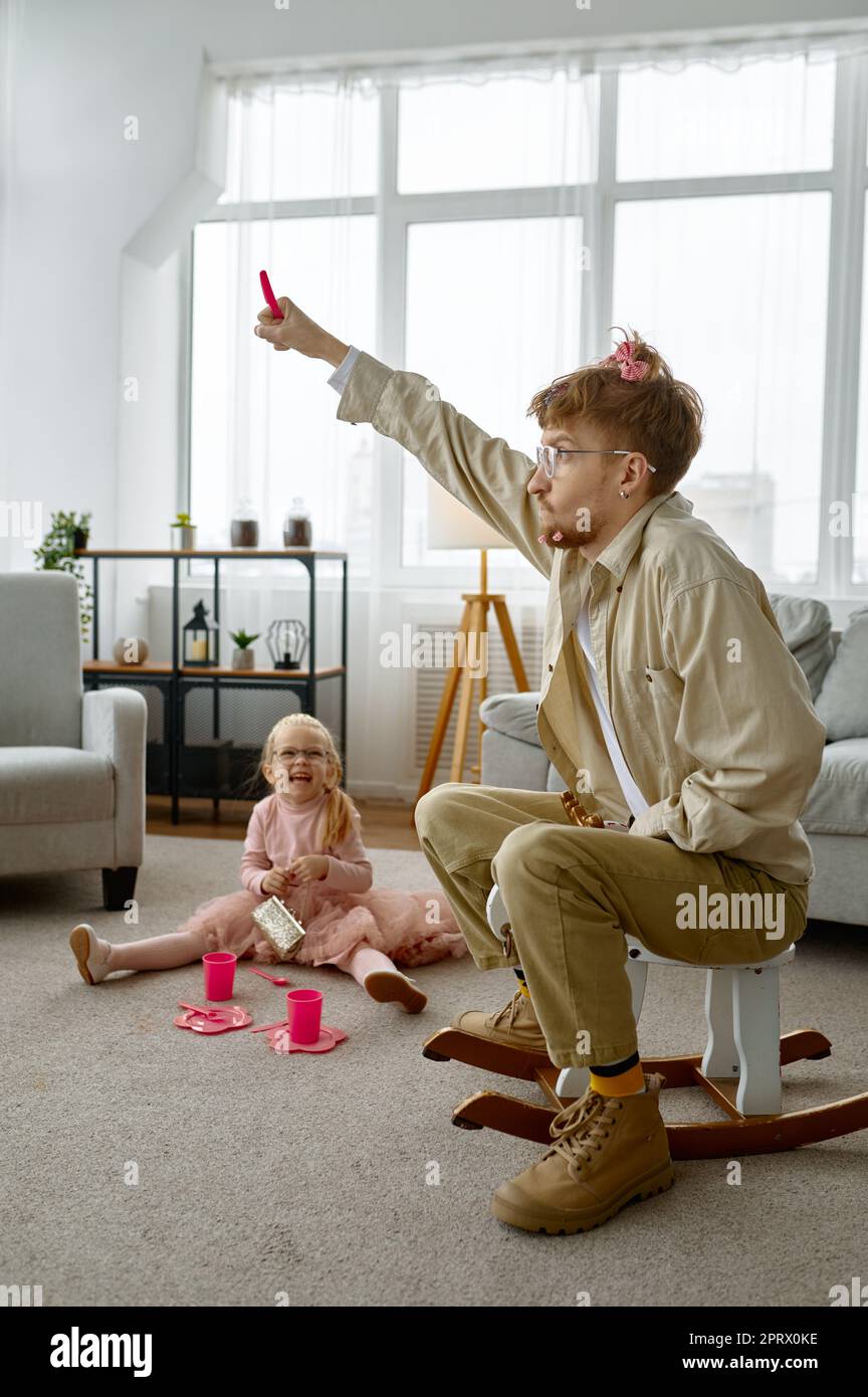 Overjoyed father and daughter spending time together Stock Photo