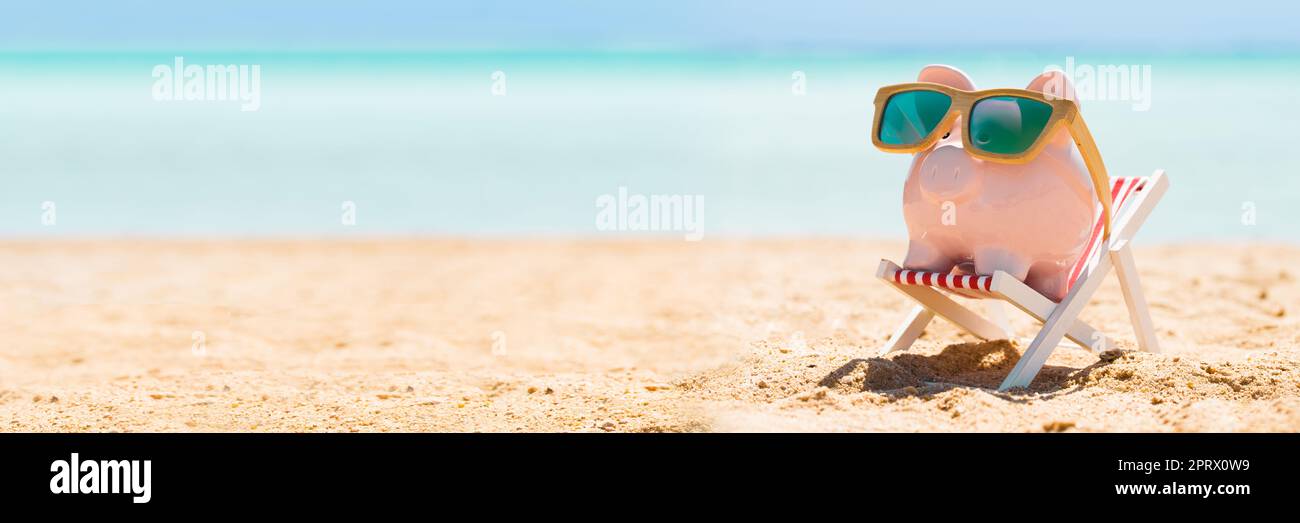 Piggy Bank With Wooden Sunglasses On The Deck Chair Stock Photo - Alamy
